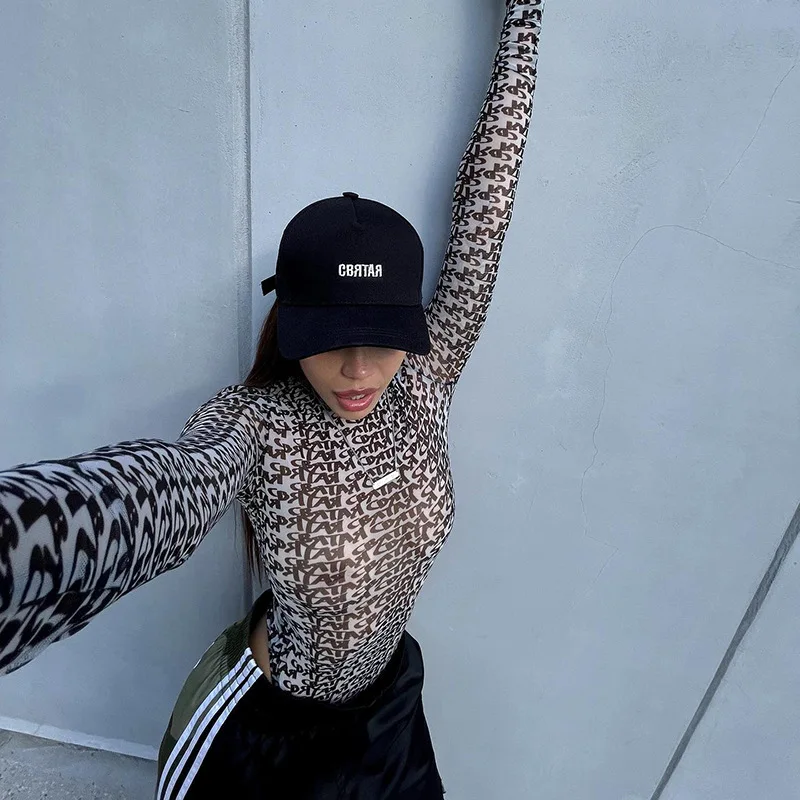 New Sexy Long Sleeved Tight Fitting Interior with Trendy Letter Printed Mesh See Through Jumpsuit for Women