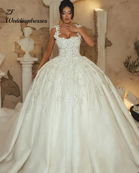 Abiti da sposa di lusso personalizzati Abiti da ballo da sposa con applicazioni floreali 3D Abiti da sposa con spalline senza schienale con strass