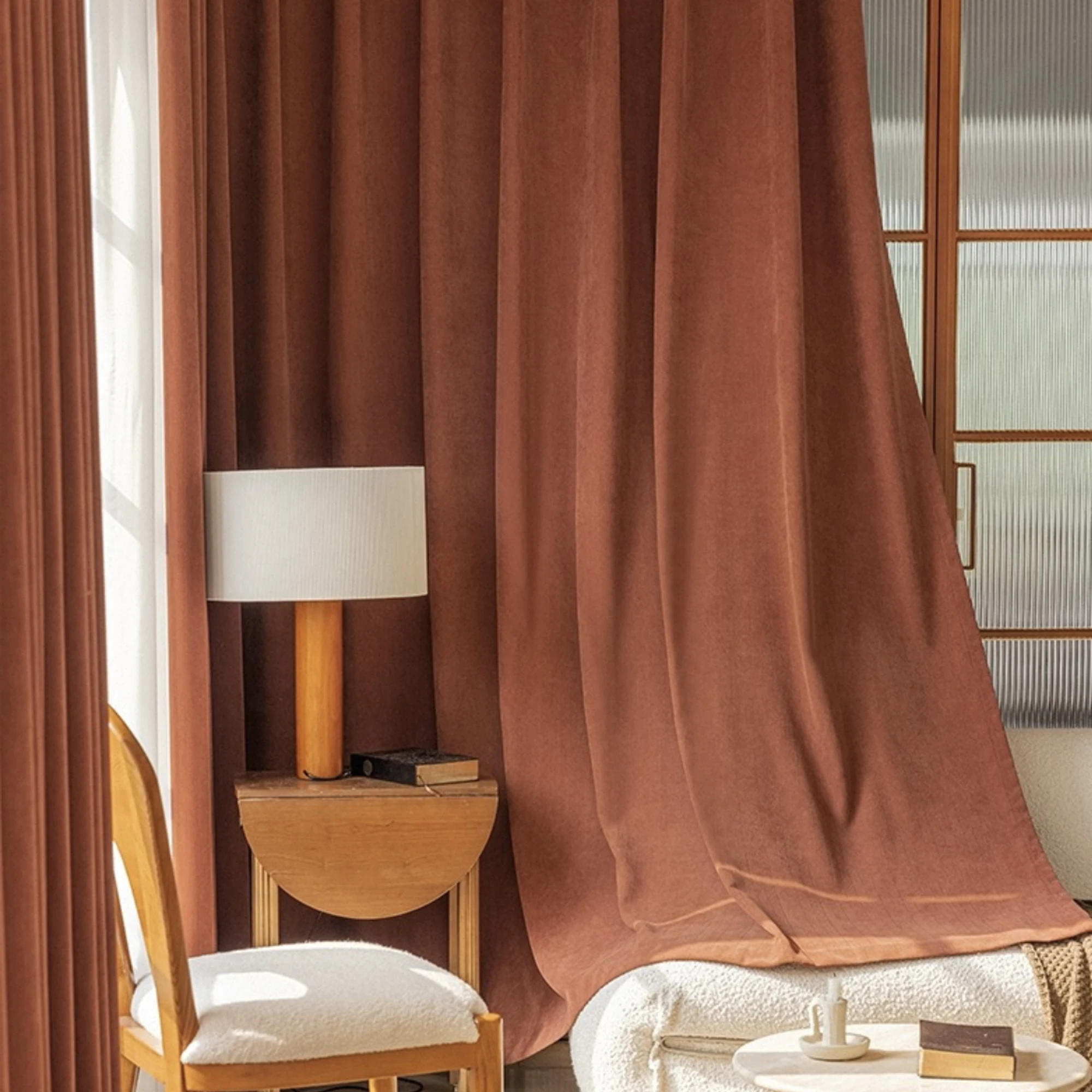 Close view of the burgundy curtain fabric and layered construction