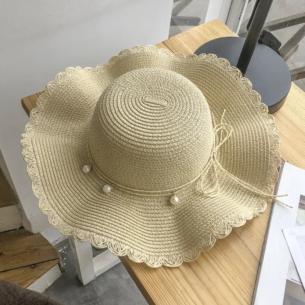 Cappello di paglia elegante a tesa larga per protezione solare_voghion.com