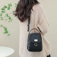 Neutral Style Shoulder Bag for Men and Women, Suitable for Travel and Photography It Is a Cross-Body Bag Made of Oxford Fabric.