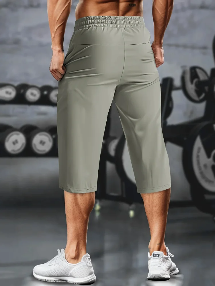 1 Stück leichte, sportliche, verkürzte Herrenhose mit Kordelzug, Reißverschlusstaschen und reflektierenden Streifen – atmungsaktives, schnell trocknendes Material – Detail 9
