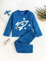 Boys' clothing space themed rocket paired with star patterned long sleeved pants set.