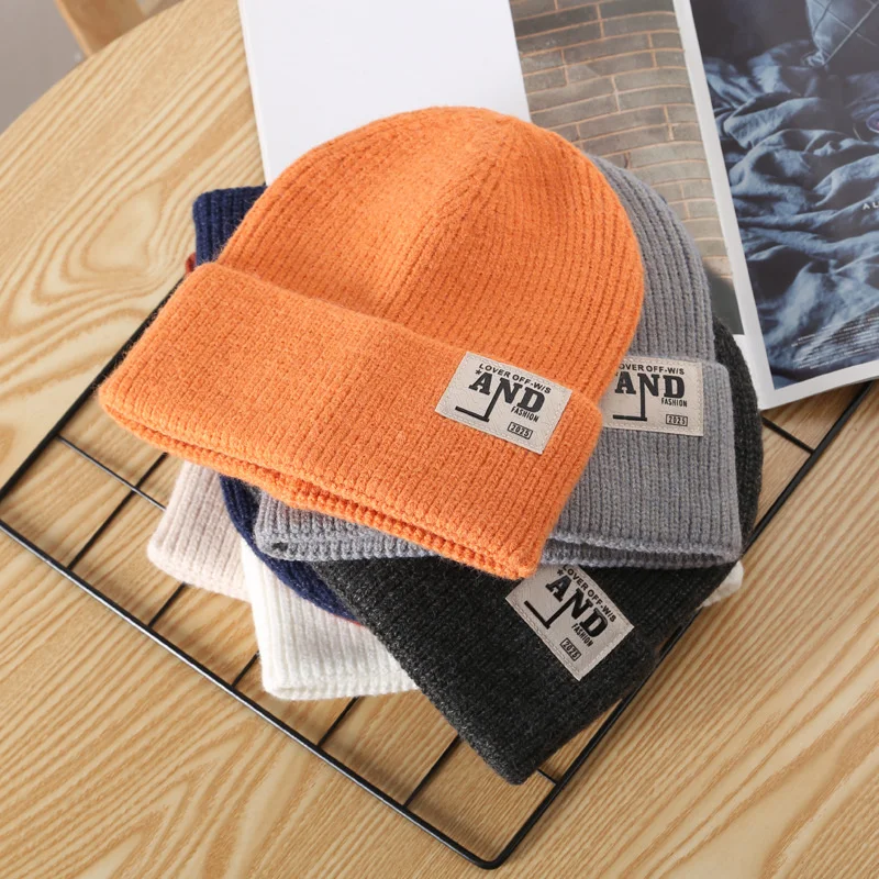 

A2 Hat Children's Autumn And Winter Warm Curling Solid Color Paste Cloth Curling Knitted Hat Outdoor Street Men's Pullover Wool