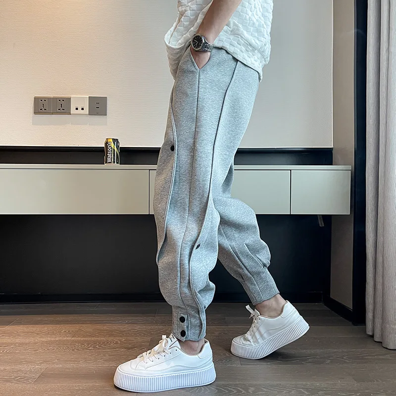 

2022 Men's Fashion Casual Sports Pants Bind feet Button Outdoors Men Elastic Zipper Bunched Foot Trousers