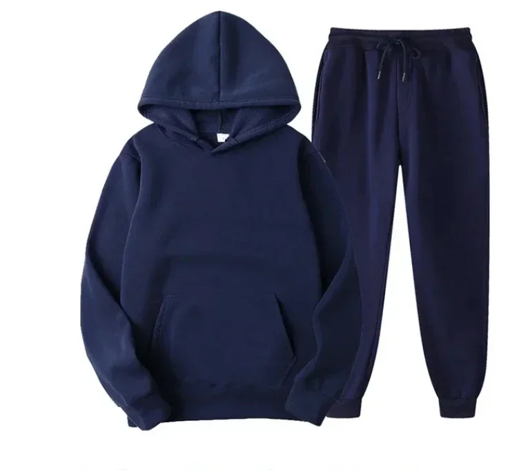 Man wearing solid color hoodie and jogger pants set in a cozy autumn streetwear setting dark blue