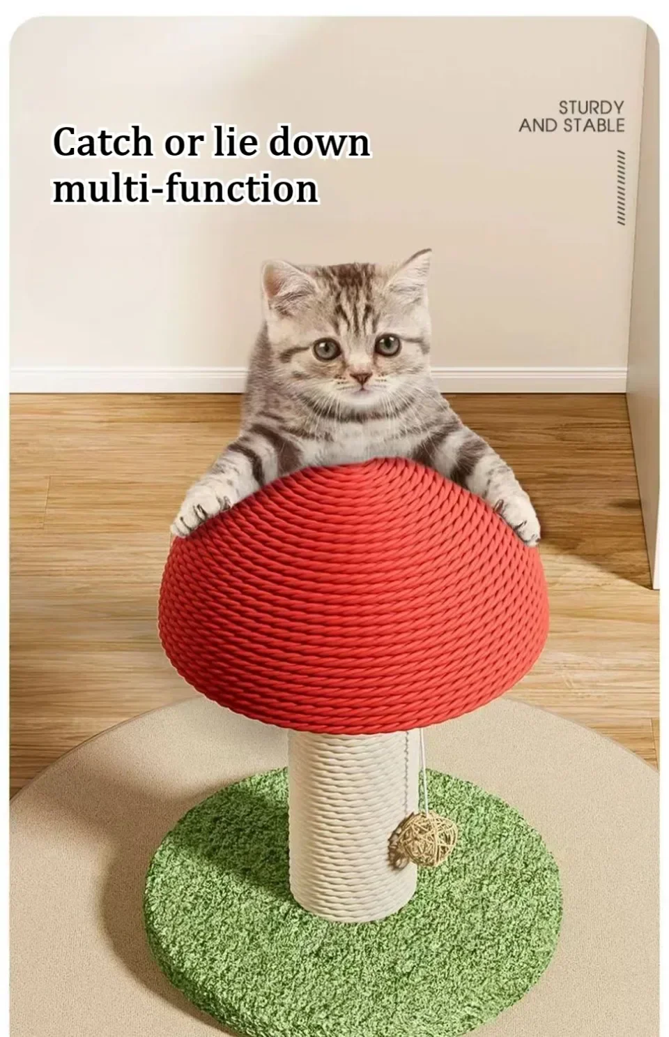 A gray tabby kitten sits on the KittyNook Cat Co. Decorative Cat Climbing Post shaped like a red mushroom.