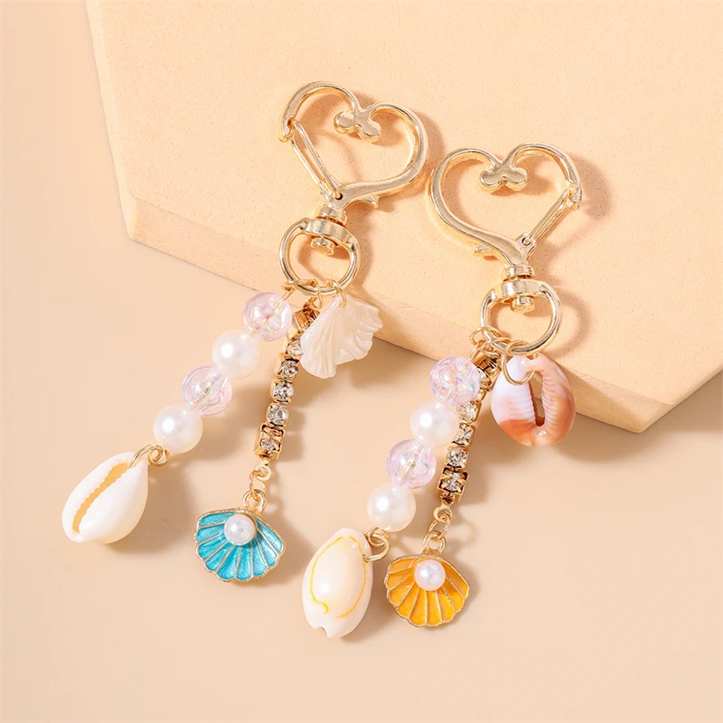 Modische Sommer-Strand Muschel-Perlen Schlüsselanhänger für Frauen Männer Auto-Schlüssel Handtaschen-Anhänger Schlüsselringe Accessoires DIY Schmuck Geschenke