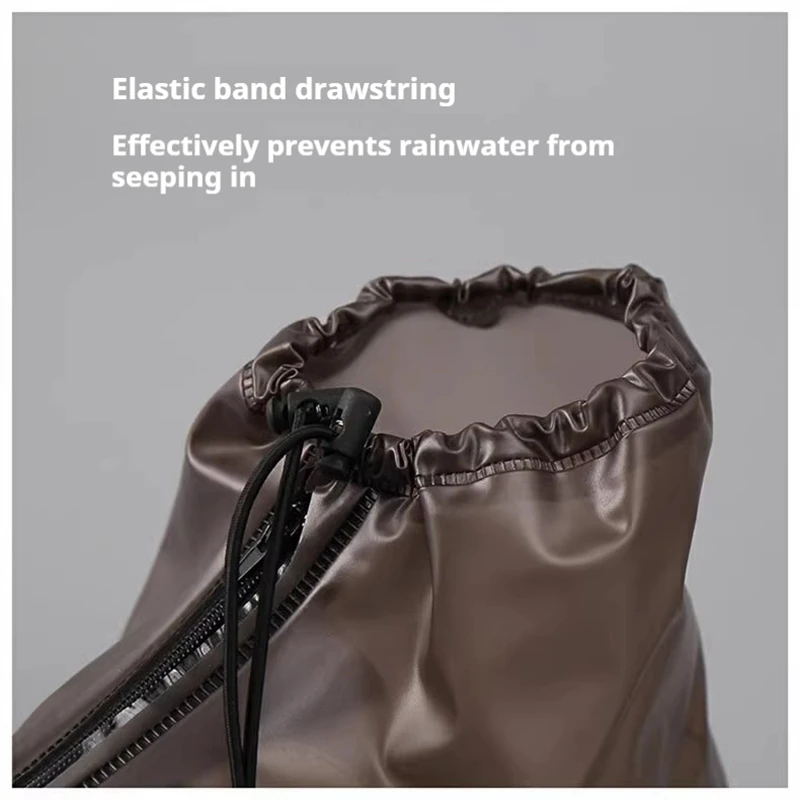 Waterproof shoe covers in black – side profile view