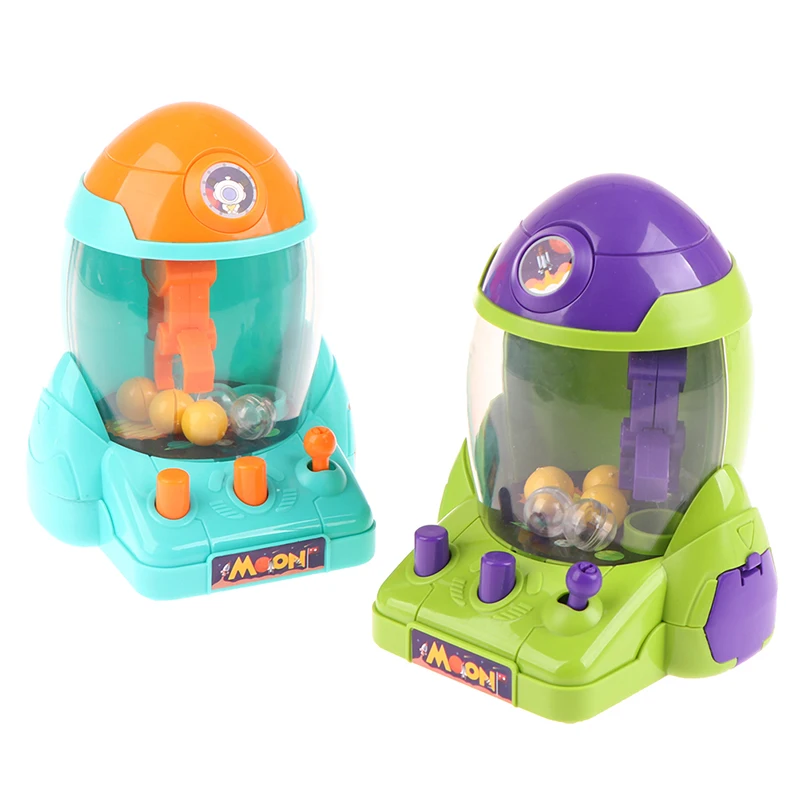 

Mini Doll Children's Desktop Manual Toys Kids Space Rocket Claw Machine Ball Catcher Game Candy Machine Kids Gifts