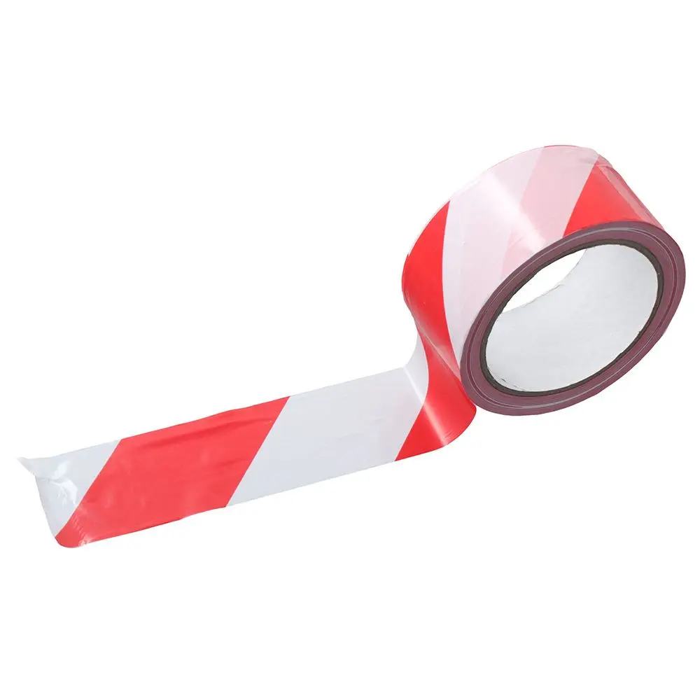 Gros plan sur le ruban de balisage adhésif sécurité rouge et blanc, texture adhésive visible au dos.
