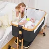 Baby Bassinet, 3 in 1 Bedside Crib for Newborn, 6 Height Adjustable  Easy Folding & with Mosquito Net & Storage Basket & Wheels 1