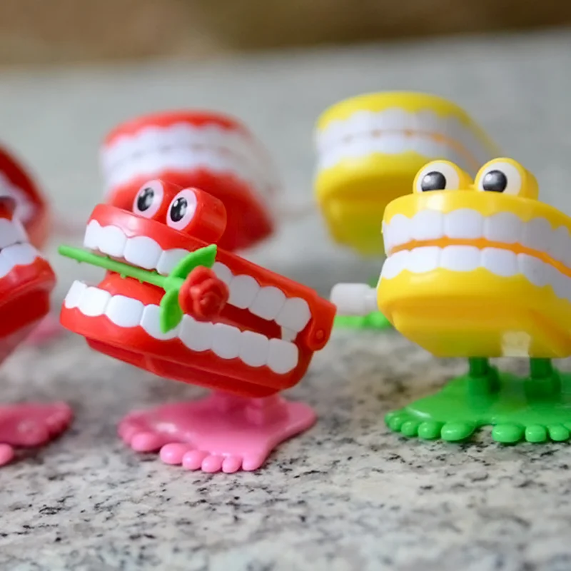 時計仕掛けのおもちゃアッパーチェーンジャンプ歯のおもちゃ子供