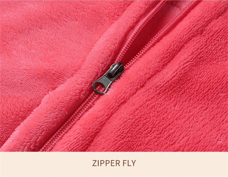 A stylish pink shawl with a zipper fly, providing winter comfort.