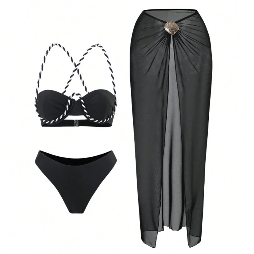 black three-piece bikini set with matching skirt