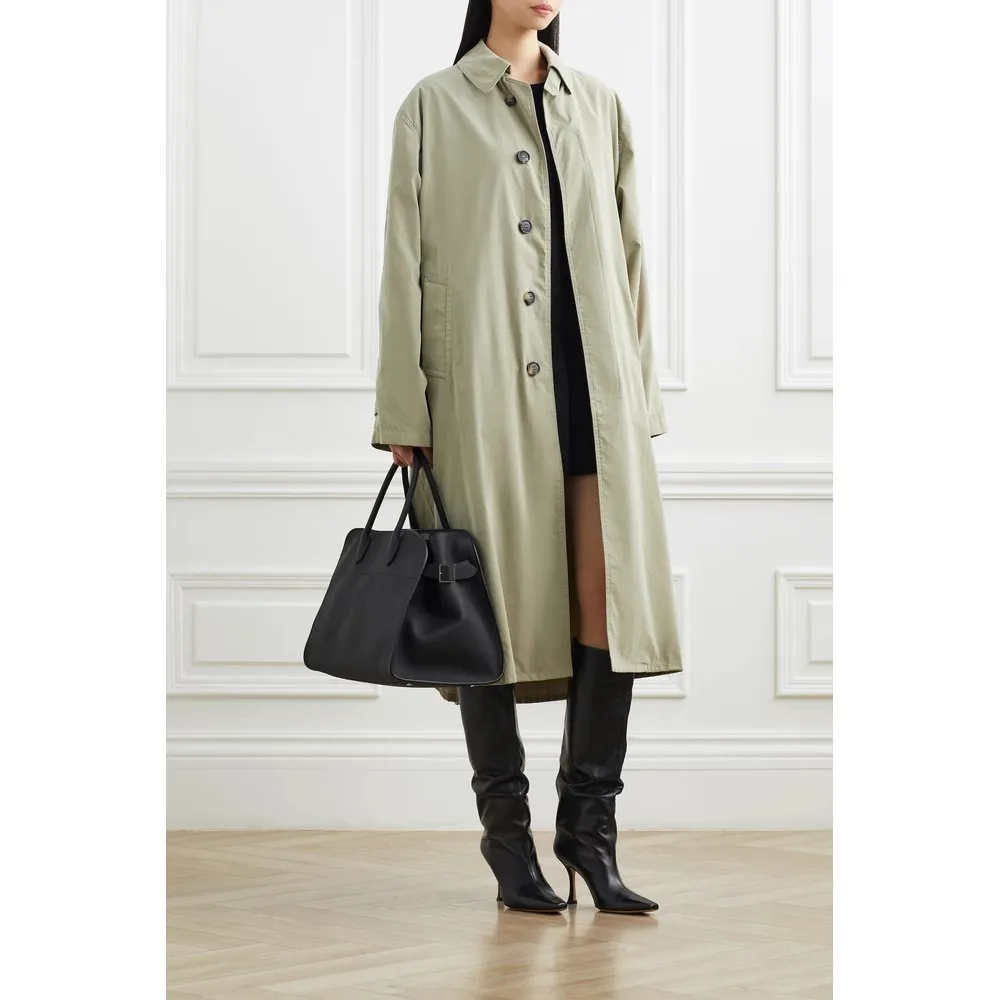 he Leather Tote bag is made of cowhide and designed for commuters, featuring a textured travel bag for women.