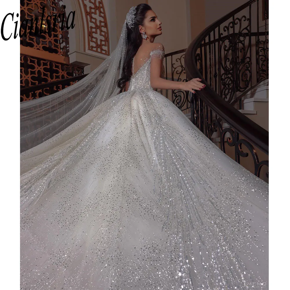 

Sparkly Crystal Illusion Cape Sleeves Dubai Wedding Dress Ball Gown Sequined Appliques Lace Saudi Arabic Bridal Gown
