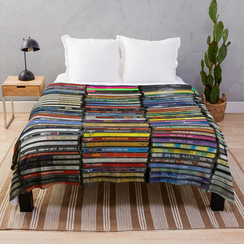 

Stacks of CDs Throw Blanket Blankets For Baby Plaid on the sofa