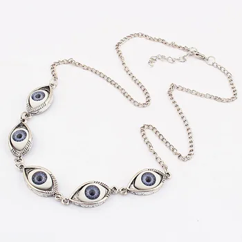 A Vintage Blue Evil Eye Necklace on a white background.