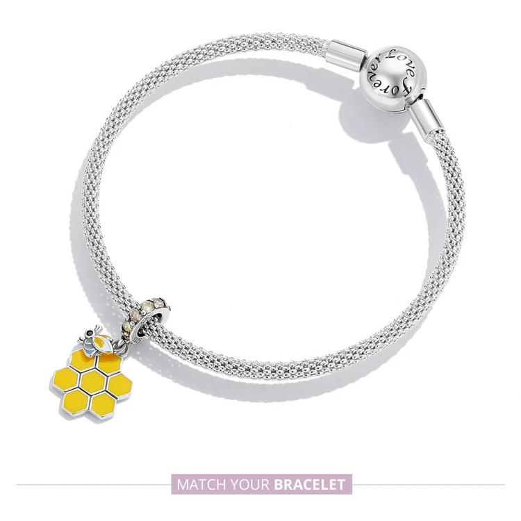 Honeycomb & Bee Dangle Charm for Pandora Bracelet | S925 Sterling Silver | Go Glam Girl 14 Honeycomb & Bee Dangle Charm for Pandora Bracelet | S925 Sterling Silver | Go Glam Girl - Show your style with the Honeycomb & Bee Dangle Charm. Hand-finished in sterling silver, this design includes a honeycomb with a padlock of small and cute bee dangling on it. The dangle is decorated with sparkling yellow and light green cubic zirconia stones. Wear in spring and summer to bring mood and beauty to your day. Perfect gift for mom, sister, grandmother, friend or yourself. | 🚚 Free Standard Shipping 7-30 days | 🥇 Top Quality Product | 💎 100% S925 Sterling Silver | 🛡️ 100% Safe & Secure checkout