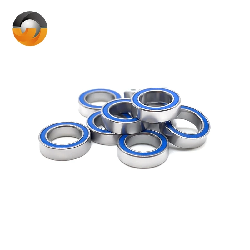 Cinq roulements MR117-2RS 7x11x3 mm double joint bleu disposés en étoile, mettant en valeur leur petite taille