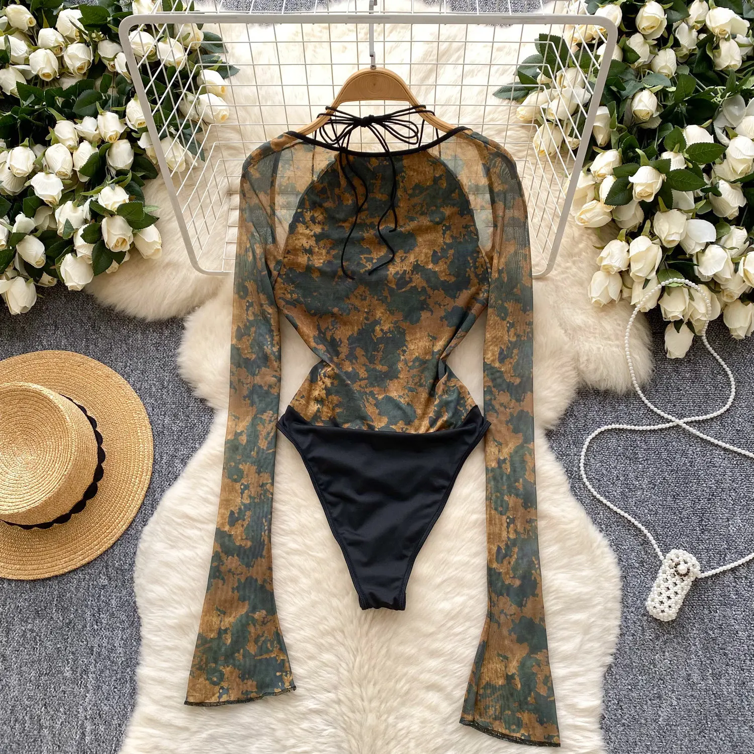 mesh sleeve detail on halter bodysuit