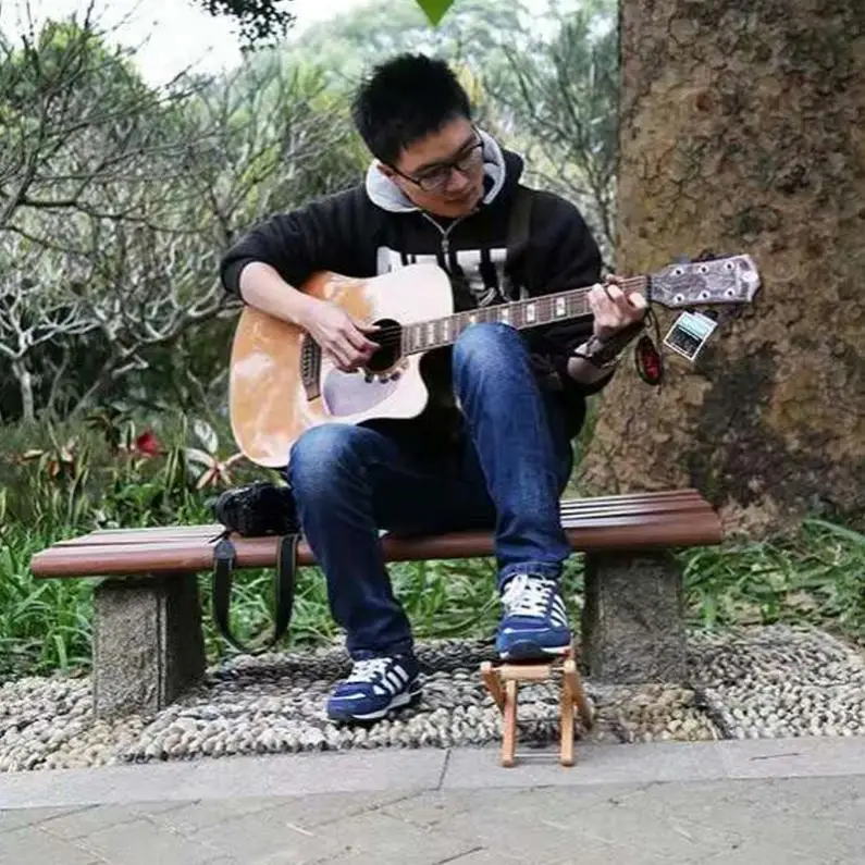https://ae01.alicdn.com/kf/Sbe2949bdfc694daaa169db1a5572c264O/Foldable-Guitar-Footstool-Footrest-Support-Solid-Wood-Guitar-Pedal-Foot-Rest-Stool-with-3-Height-Adjustable.jpg