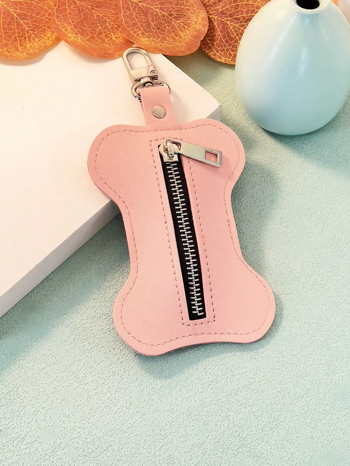 Description Picture 5 of itemA Pu leather pet trash bag collection bag poop bag bone-shaped convenient bag goes out the beautiful fashion hanging bag accesso