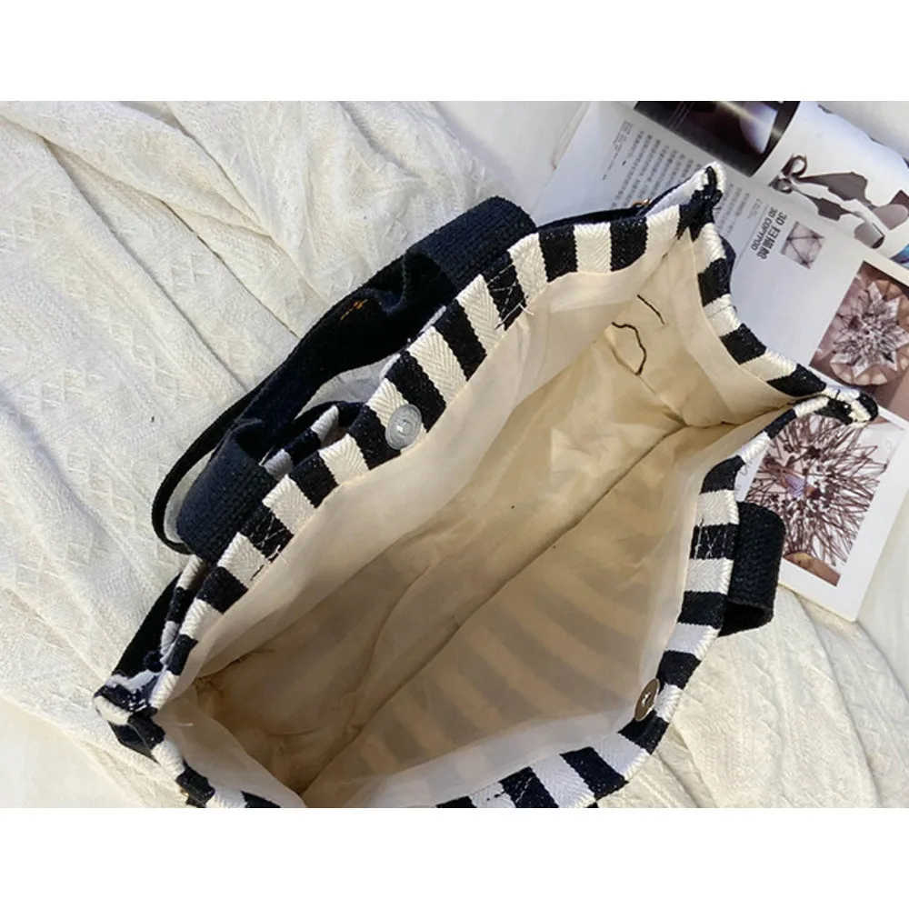 Popular striped canvas 2024 new commuter large capacity casual fashion personalized hand-held crossbody tote women's bag_voghion.com