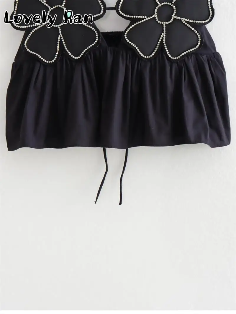 Top corto elegante con estampado floral negro a la moda para mujer, camisola Y2K con tirantes y espalda descubierta, ropa de calle elegante y sexy sin mangas para mujer