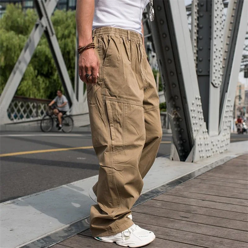 ASOS DESIGN Hourglass oversized cargo pants with multi pocket and tie waist  in khaki | ASOS