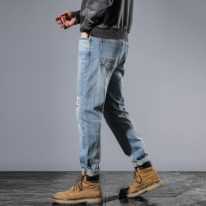 High-end personalised biker ripped patch patch men's jeans vintage washed ins light blue printed spray-painted trousers