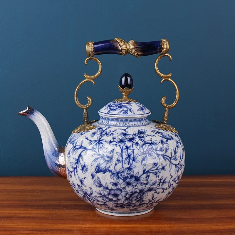 https://ae01.alicdn.com/kf/Sbed6d0add3ce4a14bf6fb037df31fb8do/New-Chinese-Ceramics-With-Copper-Classical-Blue-And-White-Porcelain-Decorated-Teapot.jpg