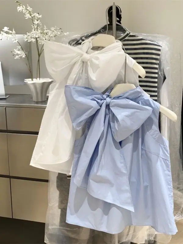 بلوزة بيضاء للنساء 2026 Blusas Mujer قمصان فضفاضة بدون أكمام بفيونكة على الموضة بلوزات صيفية حلوة للسيدات