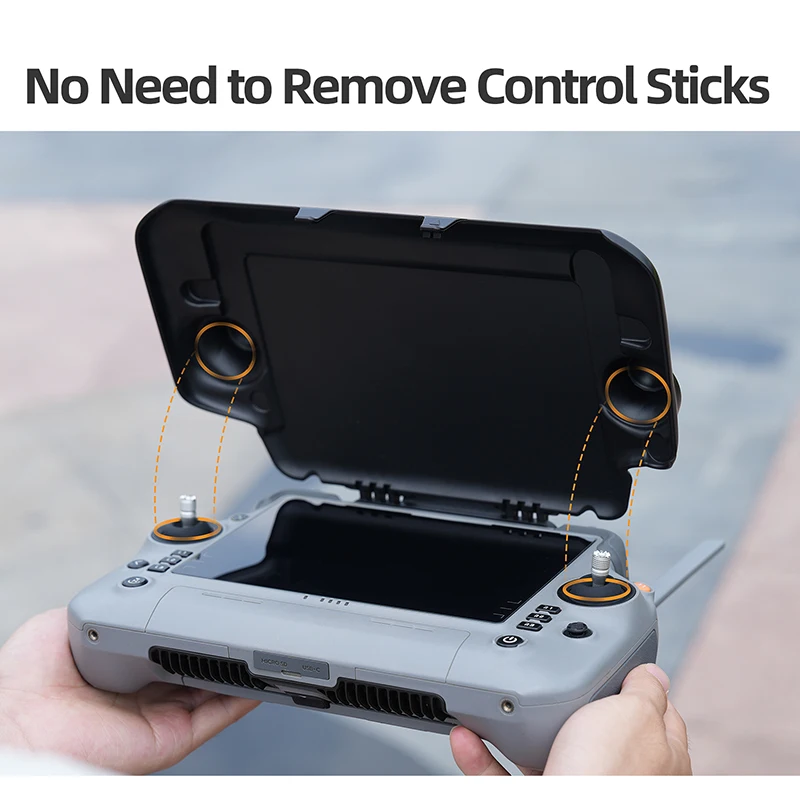 Détail de la fixation de la protection solaire anti-reflet pour télécommande DJI RC Plus 2, clips sécurisés.