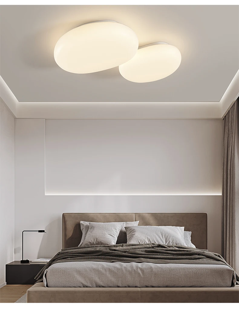 A contemporary bed with a minimalist design and a ceiling light fixture.