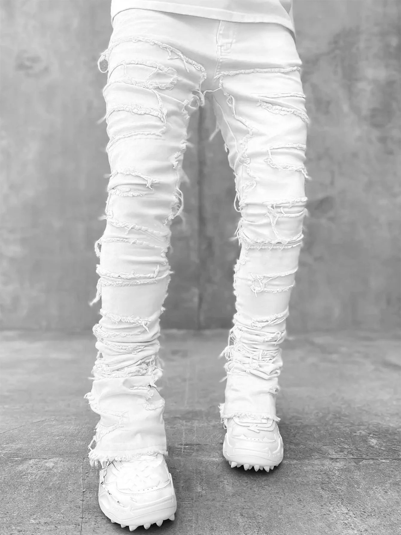 2024 główna ulica białych męskich dżinsów ułożonych w stosy, rozciągniętych patchworkowy frędzel uszkodzone dżinsowe spodnie pełnej długości spodnie Hip-pop dla mężczyzn