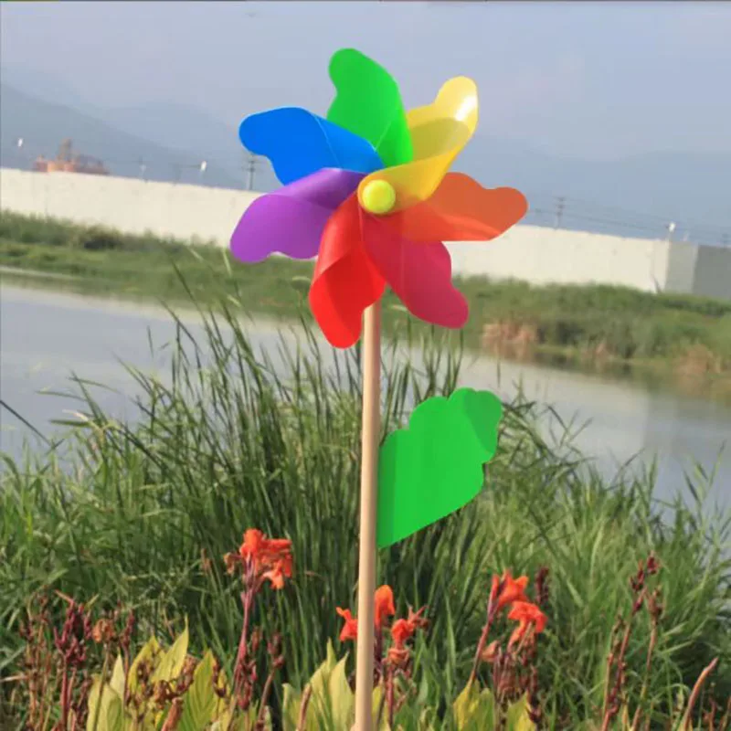 Colorful windmill outdoor decoration festival scenic park children holding rotating wooden color windmill windmill toys garden windmill