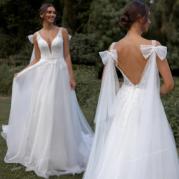 Abito da sposa romantico con grande fiocco e scollo a V sulla schiena, in tulle leggero, linea ad A, con spalline sottili e applicazioni in pizzo, personalizzabile