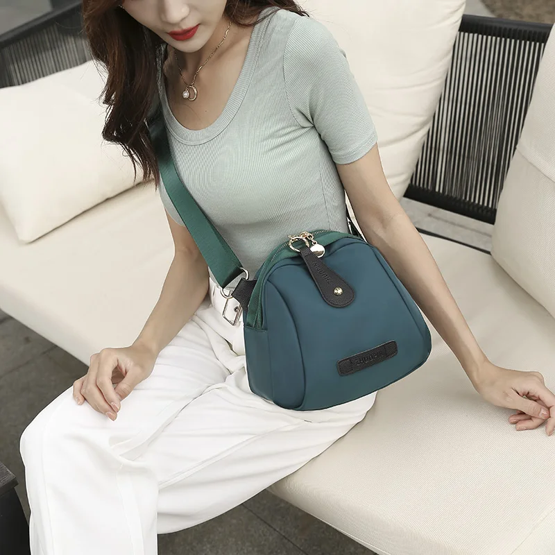 One-shoulder bag 2024 new wave girl spring and summer ladies black shell bag Oxford cloth sports wind design waterproof.