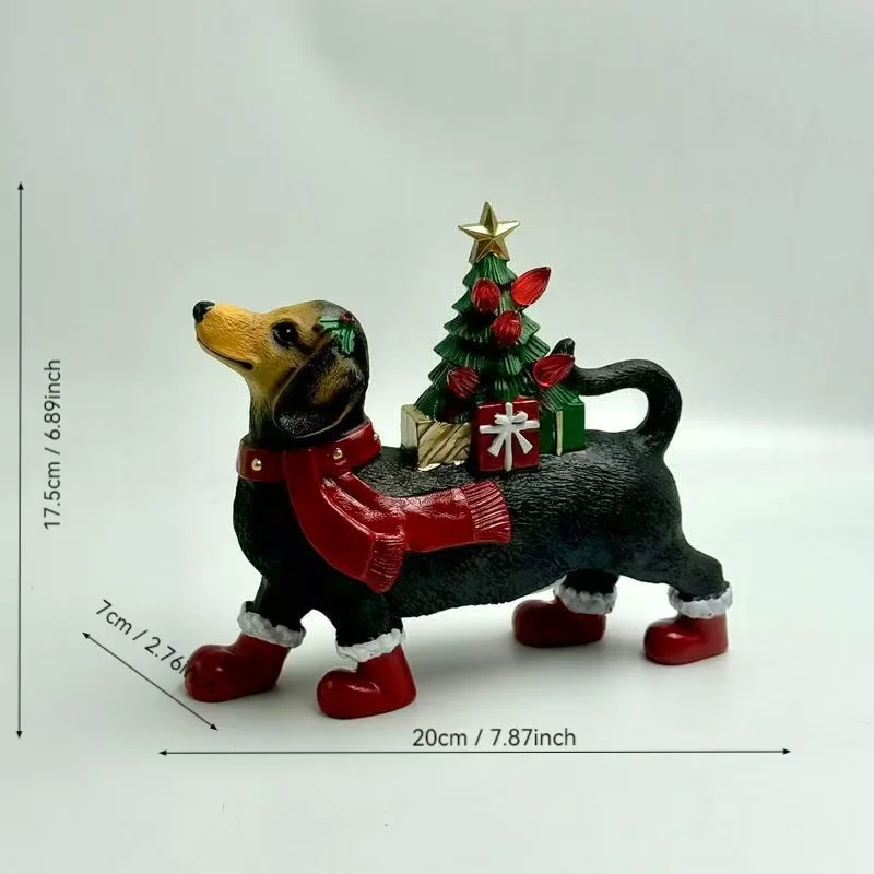 Dachshund dog resin figurine wearing a red Christmas scarf and boots with a holiday tree on its back as a tabletop decoration.