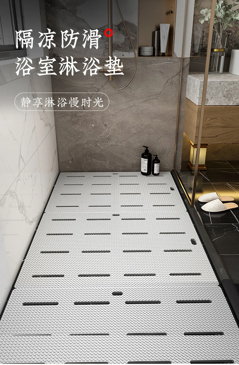 Blue bathroom non-slip mat with cartoon dinosaur pattern on tiled floor.