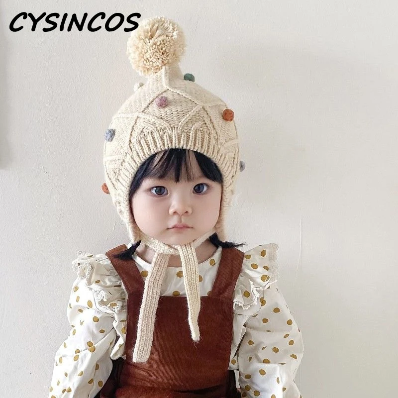 

Autumn Winter Fashion Girl Baby Hairball Earmuffs Warm Knitted Cap Baby Children Plaid Knit Casual Hat Infant Cotton Lacing Caps