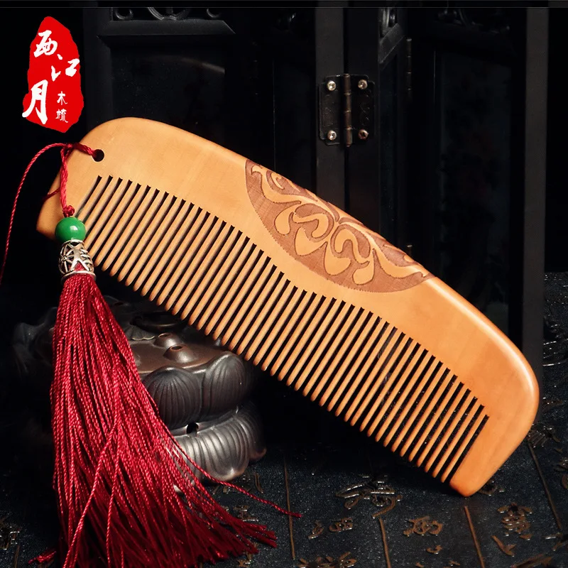 

Wooden comb peach wood small comb hairdressing double-sided carving to send tassel carving supplies small comb