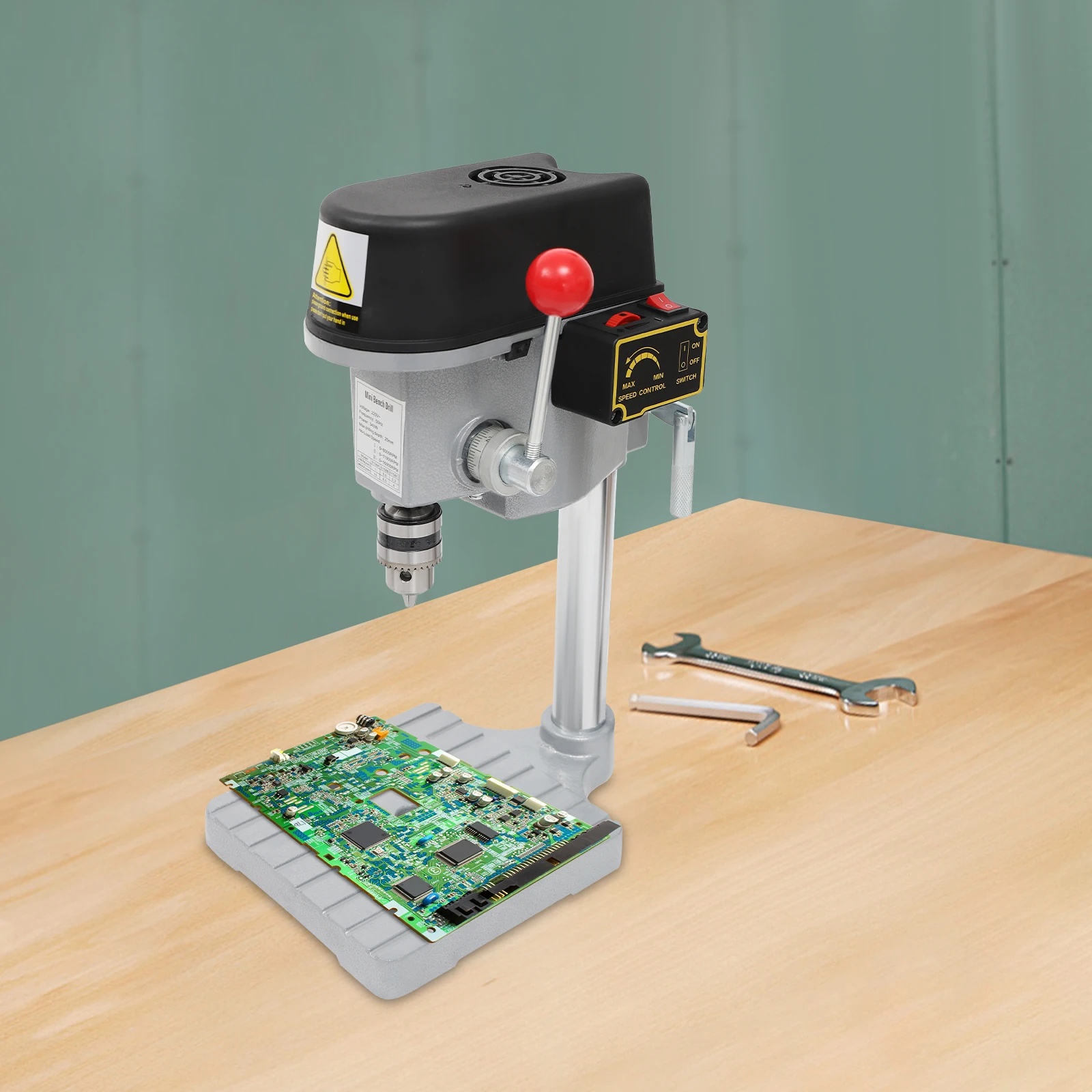 Compact drill press positioned on a small workbench