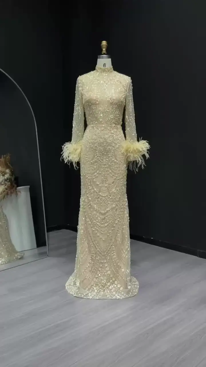 Шарон Саид золотое вечернее платье русалки с перьями и бисером длинными рукавами