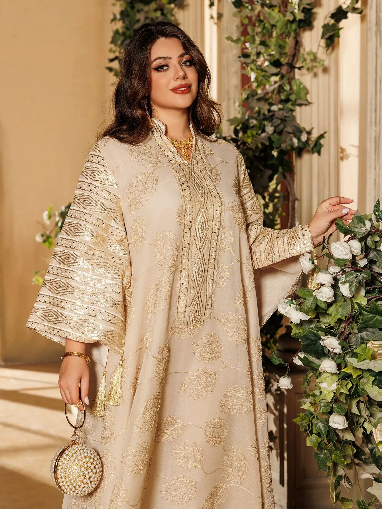 Islamic beige embroidered abaya for Muslim women with gold details, perfect for official occasions in the Middle East such as the...