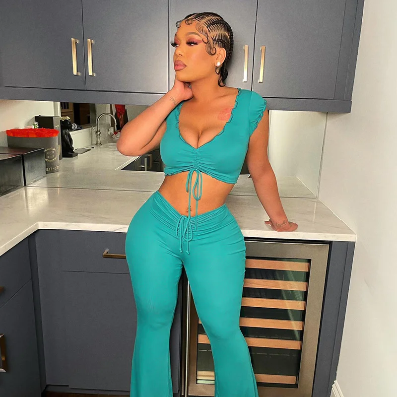 

Wind Solid Color Fashion Set Slim Fit Solid Color V-Neck Wooden Ear Edge Top High Waist Raised Hip Flare Pants Two Piece Set