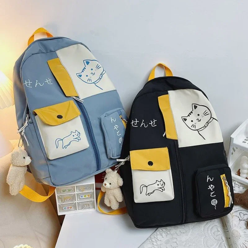 Korean cute cartoon cat woman backpack for high school students, large capacity waterproof nylon travel bag.