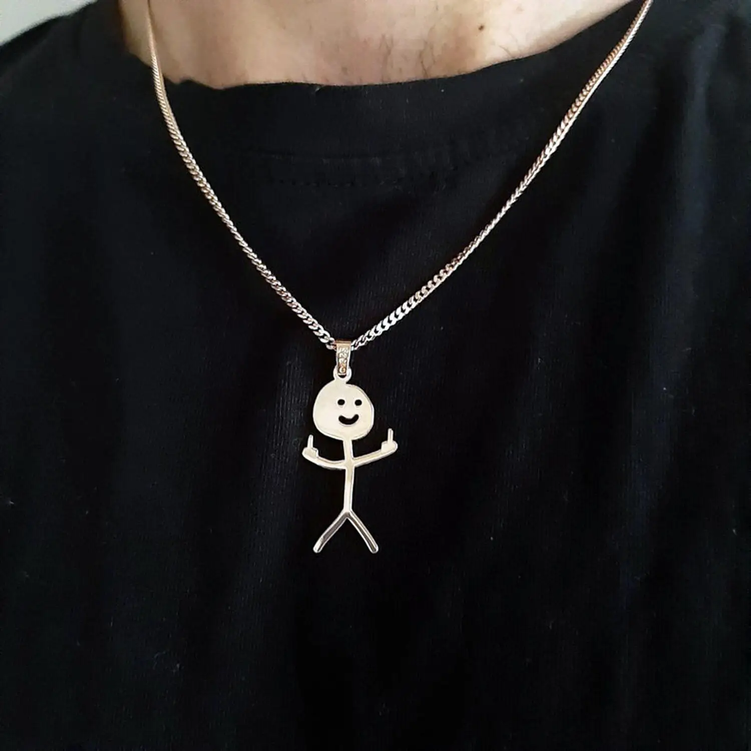 A person showcasing the Creative Doodle Pendant Necklace, a new women's fashion necklace featuring a stylish stick figure pendant.